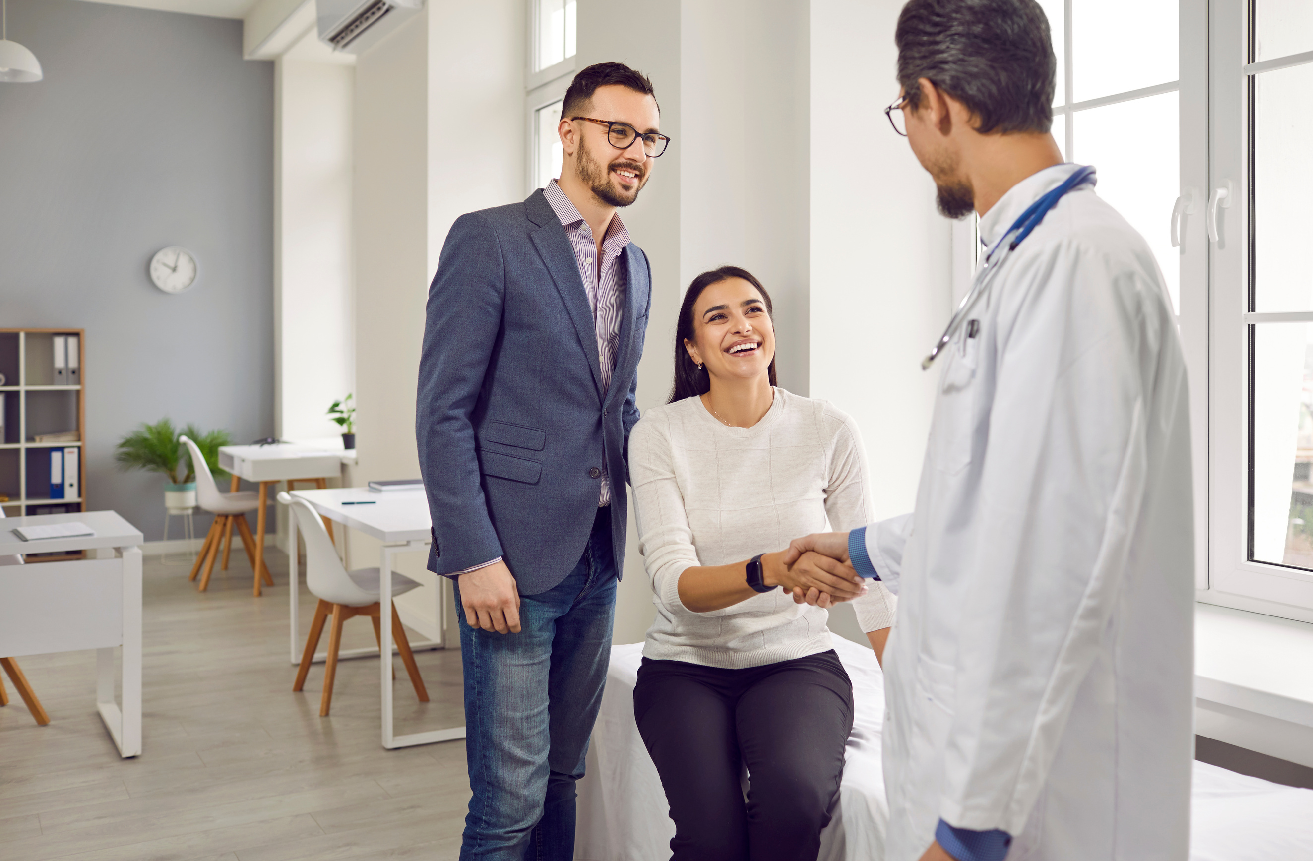 Young Attractive Couple at Doctor's Appointment in the Office of Family Planning Medical Institution.